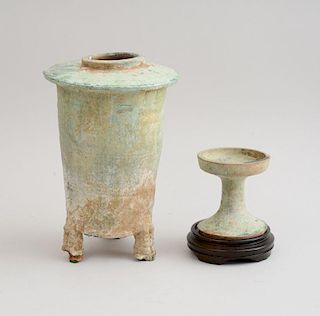 TANG IRIDESCENT PALE GREEN GLAZED POTTERY TRIPOD FUNERARY VESSEL AND A TANG POTTERY STEMMED CUP