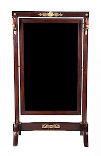 A French Empire Style Gilt Bronze Mounted Cheval Mirror Height 67 3/4 x width 38 1/4 inches.