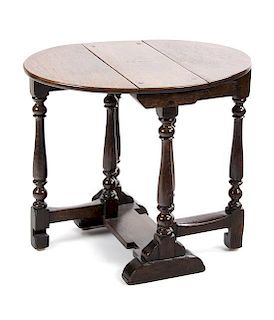 An English Oak Gateleg Table Height 21 x width 18 1/2 x depth 8 inches (closed).