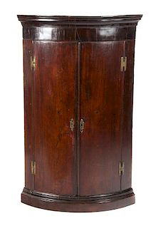 A Georgian Mahogany Hanging Corner Cabinet Height 43 1/2 x width 27 inches.