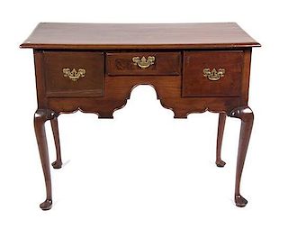 A Queen Anne Style Mahogany Lowboy Height 30 1/4 x width 39 x depth 21 1/4 inches.