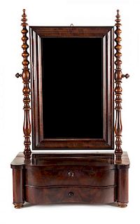 An American Empire Shaving Mirror Height 29 3/4 x width 17 3/4 x depth 10 3/4 inches.