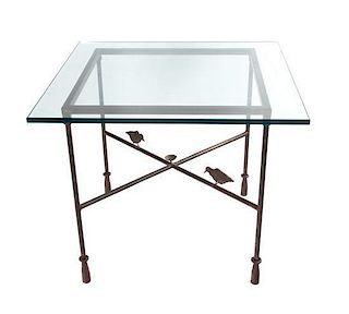 A Giacometti Style Metal Table Height 28 3/4 x width 36 x depth 36 inches.