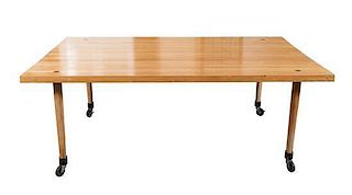 A Mid-Century Butcher-Block Dining Table Height 29 x width 77 1/2 x depth 48 inches.