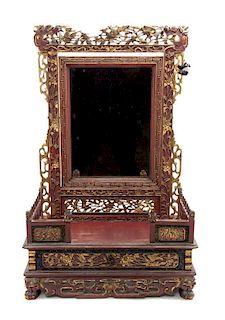 A Chinese Parcel Gilt Red Lacquer Carved Wood Dressing Mirror Height of mirror 31 x width 20 inches.
