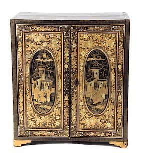 A Chinese Export Black and Gilt Lacquer Jewelry Cabinet Height 13 3/4 x width 12 1/4 x depth 6 1/2 inches.