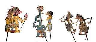 A Collection of Five Indonesian Wayang Kulit Shadow Puppets Height of tallest 42 inches.