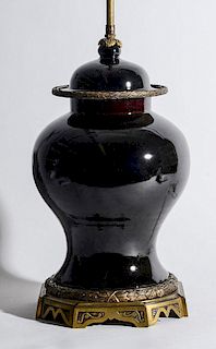 LOUIS XVI STYLE GILT-METAL-MOUNTED CHINESE BLACK GLAZED POTTERY JAR AND COVER, MOUNTED AS A LAMP
