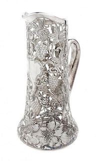 * A Silver Overlay Glass Pitcher Height 11 1/4 inches.
