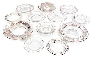 * A Collection of Silver Overlay Glass Plates Diameter of largest 9 3/4 inches.