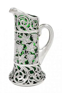 * A Silver Overlay Glass Pitcher Height 9 1/8 inches.