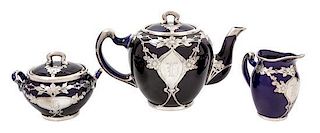 * A Lenox Porcelasin Silver Overlay Tea Service Height of teapot 5 3/4 inches.