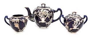 * A Lenox Porcelain Silver Overlay Partial Tea Service Height of teapot 5 5/8 inches.