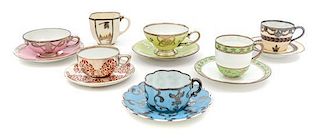 * A Group of Silver Overlay Porcelain Teacups and Saucers Diameter of widest 4 3/4 inches.