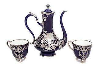 * Three Porcelain Silver Overlay Tea Articles Height of first 8 1/4 inches.