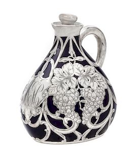 * A Porcelain Silver Overlay Pitcher Height 7 inches.