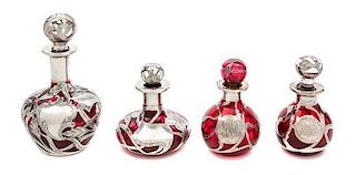 * Four Silver Overlay Glass Perfume Bottles Height of tallest 5 inches.