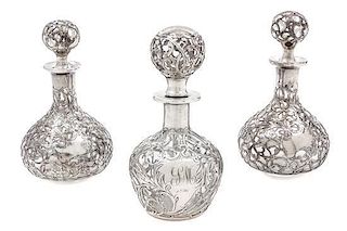 * A Group of Three Silver Overlay Glass Bottles Height of tallest 5 1/2 inches.