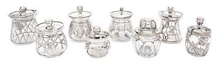 * A Collection of Eight Silver Overlay Covered Jars Height of tallest 4 3/4 inches.