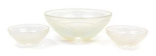 * A Set of Three R. Lalique Molded Glass Bowls Diameter of largest 9 inches.