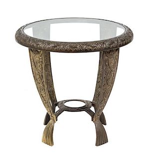 An American Cast Iron Art Deco Side Table, Seville Studios Height 16 x diameter 21 inches.