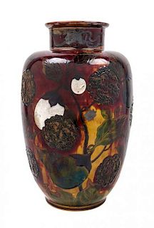 An American Silver Inlaid and Enameled Porcelain Vase Height 14 1/4 inches.