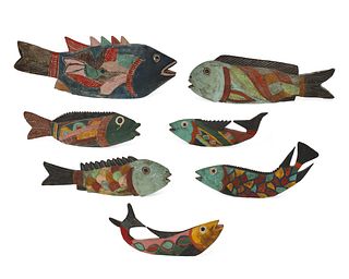 A group of folk art wooden fish