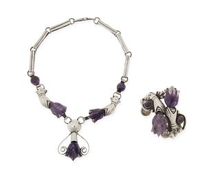 A silver pendant necklace and cuff with amethysts