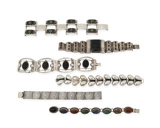 A group of Mexican silver bracelets