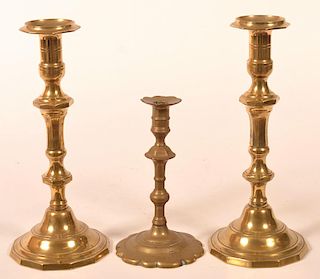 Three Antique Brass Candlesticks.