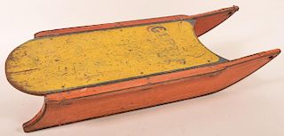 Painted wooden child's sled with iron runners