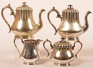 Good four piece "Lodge" nickel on copper tea set with floral finials