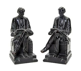 * A Pair of American Bronze Figural Bookends, each depicting a seated Abraham Lincoln. Height of each 8 1/4 inches.