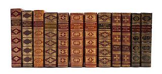 (BINDINGS)  A group of 11 leather-bound books with gilt-tooled spines.