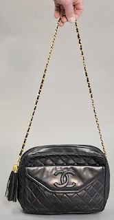 Large Chanel black leather quilted bag/purse having zipper center and monogram front flap.