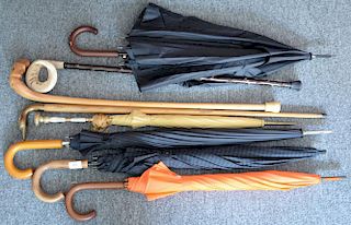 Group lot to include three canes and two umbrellas.