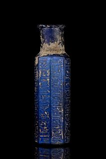 BLUE GLASS BOTTLE WITH KUFIC CALLIGRAPHIC SCRIPT