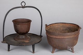 Cast iron kettle, pestle, and hanging pot rack.