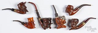 Six carved burl pipes