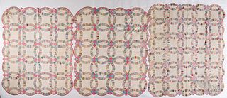 Three double wedding ring patchwork quilts, 20th c