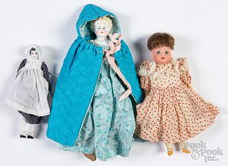 Two china dolls, together with a bisque head