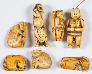 Seven Japanese carved bone netsuke.