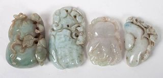 Four Chinese carved pendants
