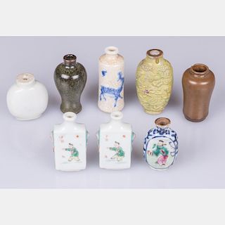 A Collection of Eight Chinese Porcelain and Stoneware Snuff Bottles, 19th/20th Century.
