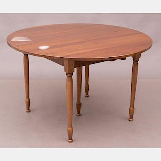 An American Cherry Table with Four Cherry Windsor Chairs by Nichols and Stone, Gardner MA, 20th Century,