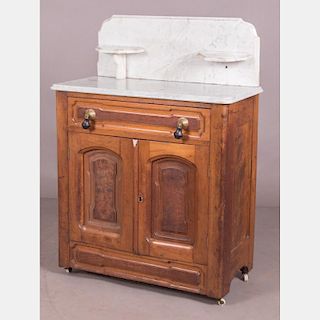 A Victorian Walnut and Marble Washstand, 19th Century.