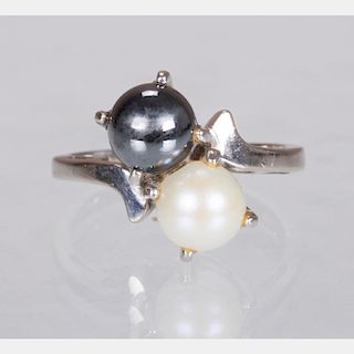 A 10kt. White Gold, White and Black Pearl Ring,