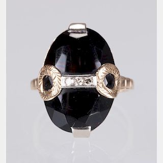 A 10kt. Yellow and White Gold, Onyx and Diamond Ring,