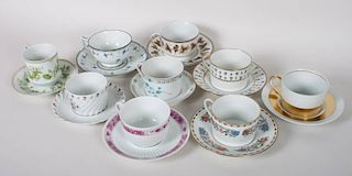 Nine assorted Limoges porcelain cups and saucers