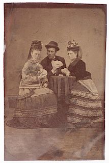 Tintype of Two Women and a Man Playing Poker. American, ca. 1870s. One of the women stares at the viewer, displaying her winning hand. 2 3/8 x 3 5/8î